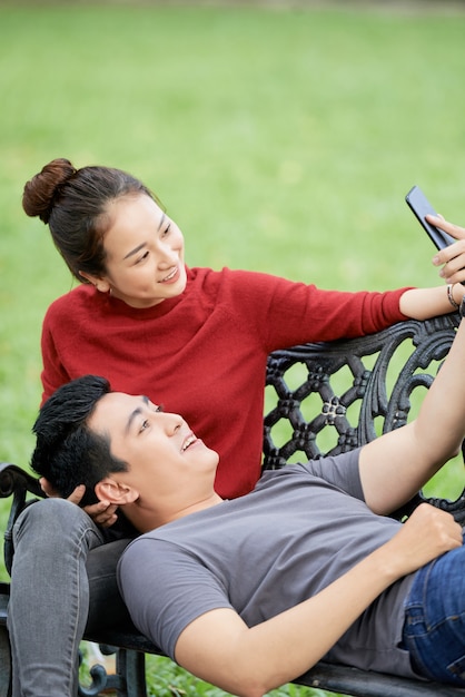 Free photo happy couple taking selfie