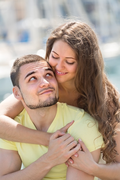 Free photo happy couple taking sunbath