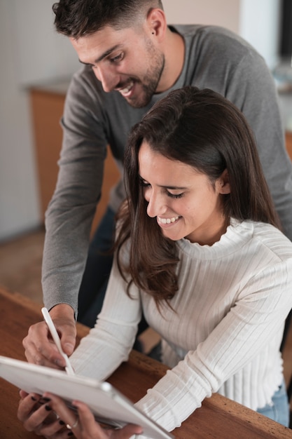 Happy couple using a tablet