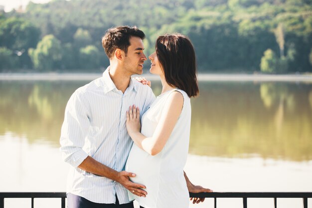 Happy couple waiting a baby, anticipating parent role