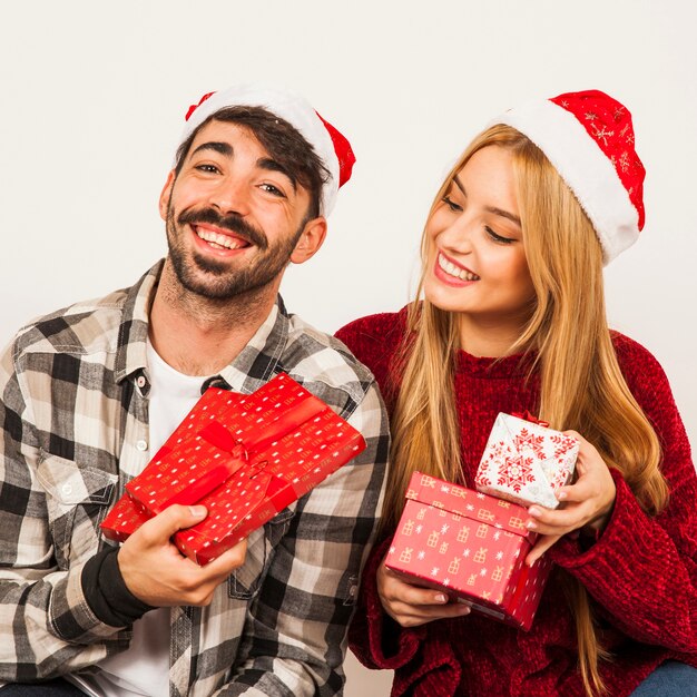 Happy couple with gift boxes