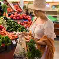 Free photo happy customer buying veggies