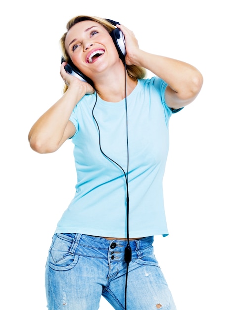 Happy dancing woman with headphones looking up 