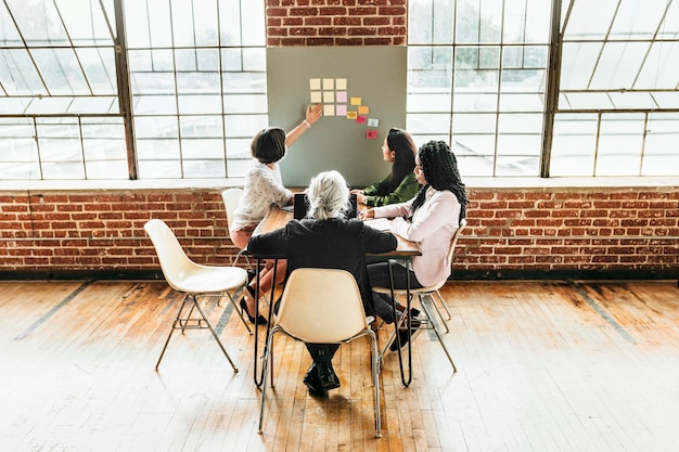 Happy diverse businesswoman brainstorming ideas