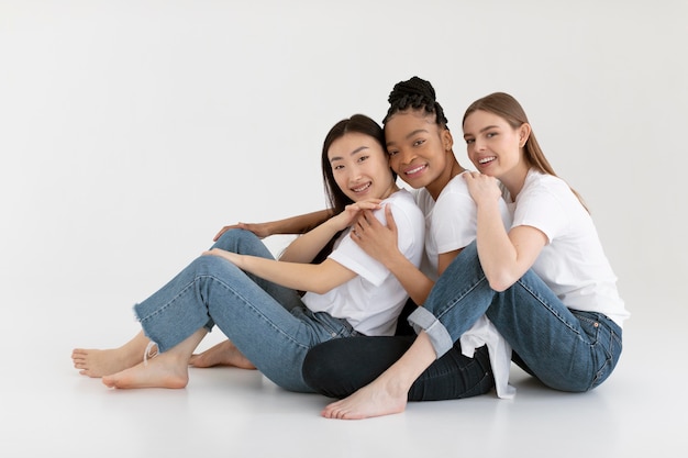 Free photo happy diverse friends posing full shot