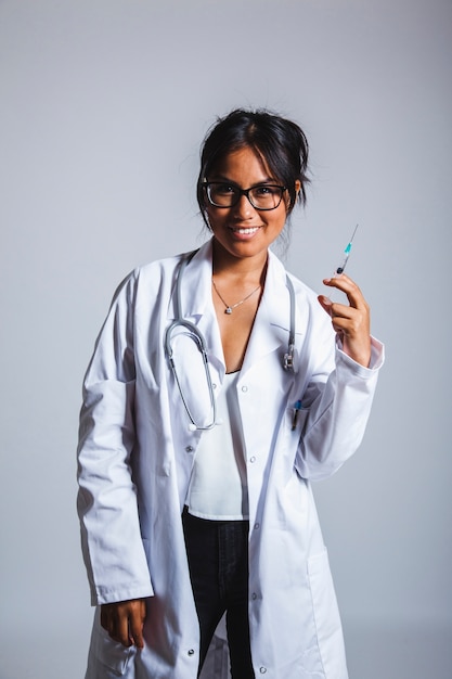 Happy doctor with vaccine