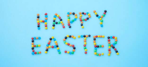Happy Easter inscription from small candies 