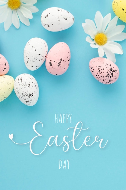Free photo happy easter poster with eggs and daisies on a blue background