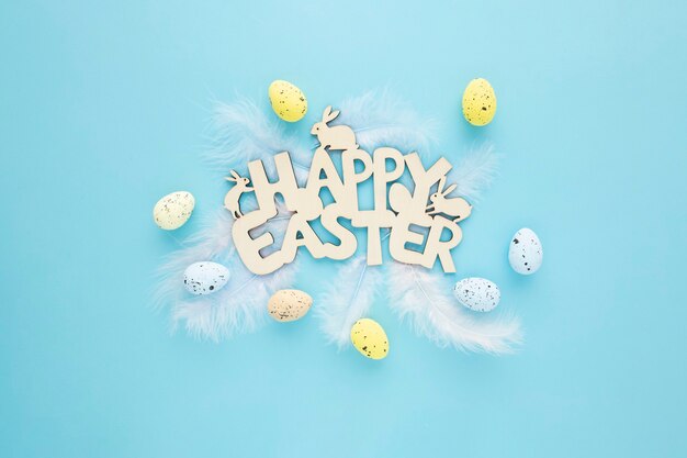 Happy Easter wooden sign with eggs on a blue background