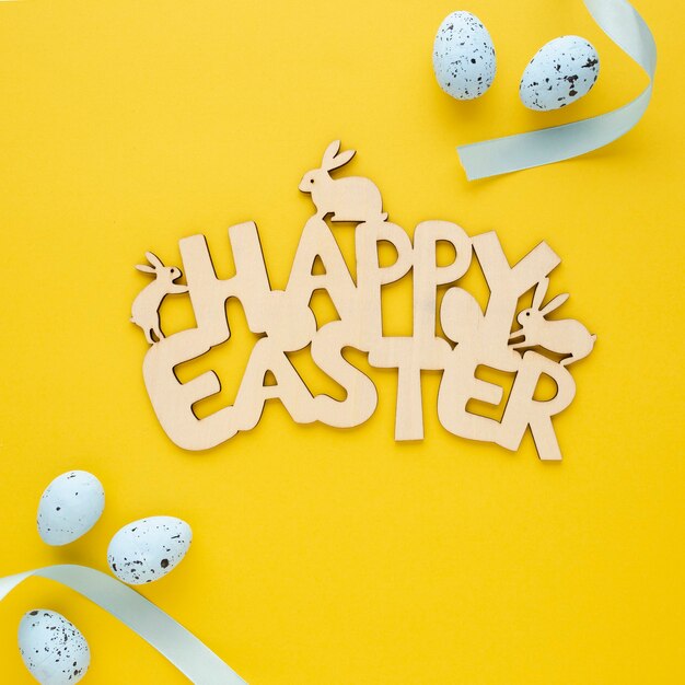 Happy Easter wooden sign with eggs and flowers