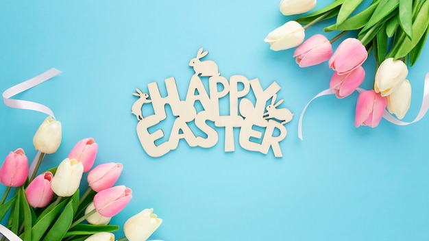 Happy Easter wooden sign with tulips on a blue background