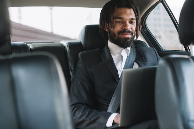 Happy employee using laptop