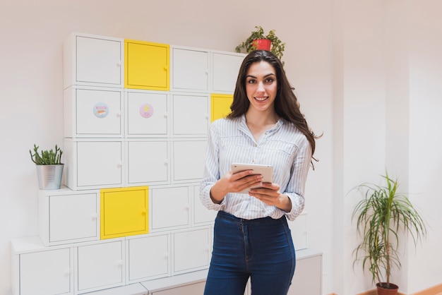 Free photo happy employee with lockers background