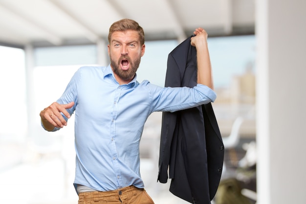 Happy entrepreneur holding his jacket