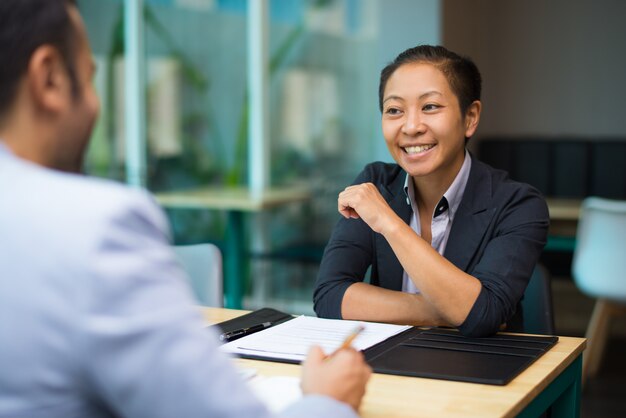 Happy excited businesswoman supporting idea of colleague