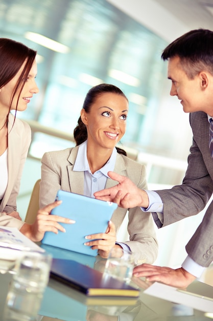 Free photo happy executives smiling at her partner