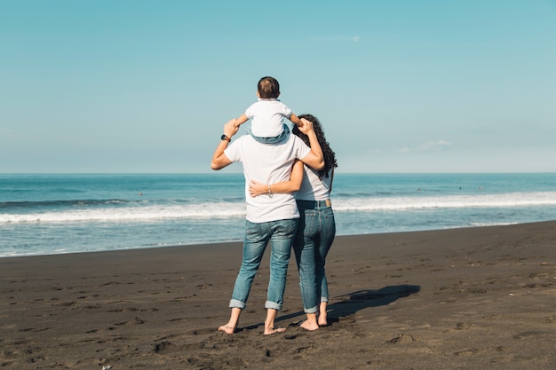 Happy family admiring sea view