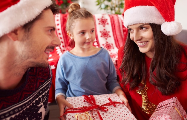 Happy family at Christmas with presents