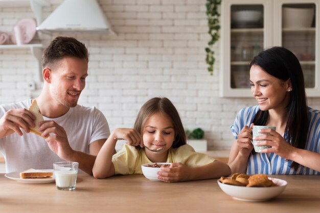 Happy family eating together