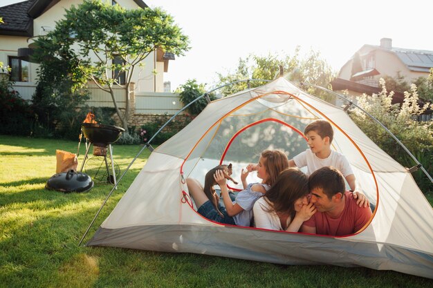 Happy family enjoying in cam tent at park