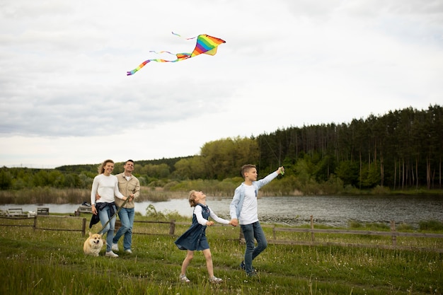 Happy family flying kite