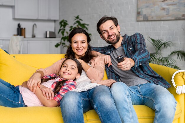 Happy family front view on sofa