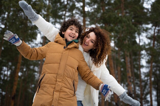 Happy family having fun outdoors medium shot