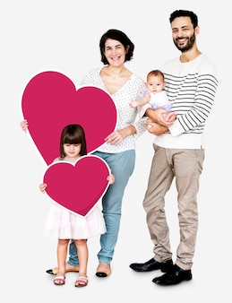 Happy family holding heart shaped icons