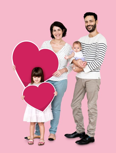 Happy family holding heart shaped icons