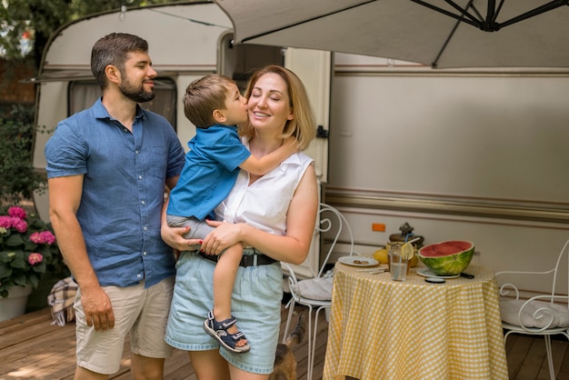 Happy family living in a caravan with copy space