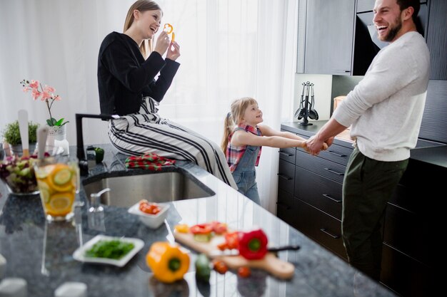 Happy family playing in kitchen
