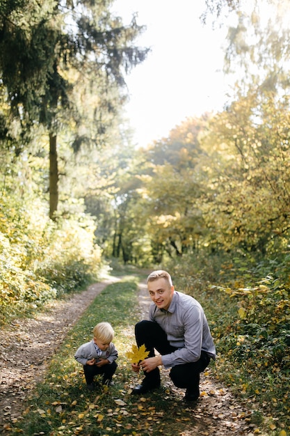 happy family playing and laughing in autumn park