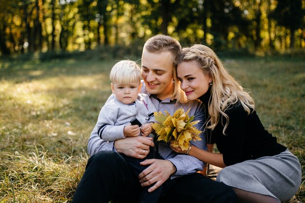 happy family playing and laughing in autumn park