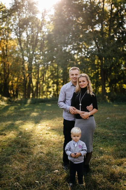 happy family playing and laughing in autumn park