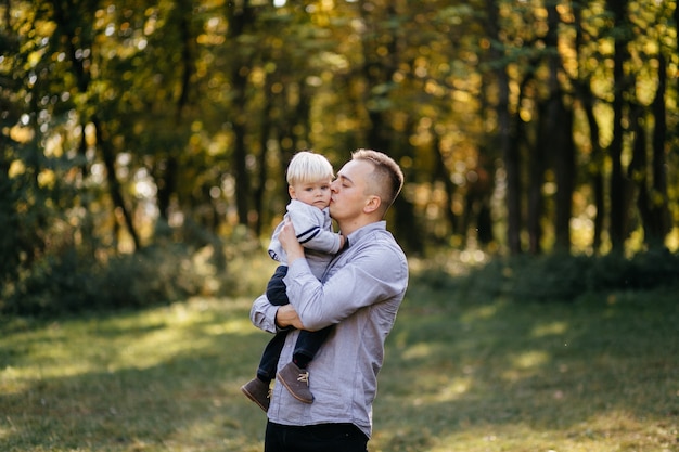 happy family playing and laughing in autumn park