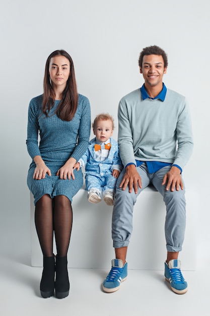 Free photo happy family portrait. interracial marriage with a baby