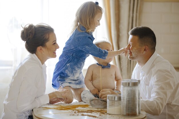 happy family together preparing bread