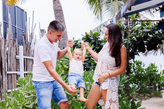 Happy family on vacation with little baby boy