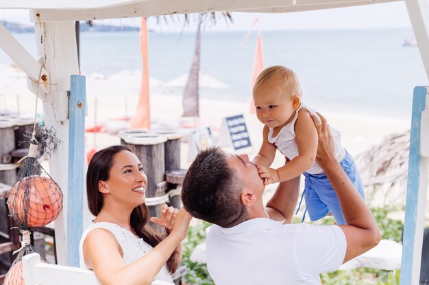 Happy family on vacation with little baby boy