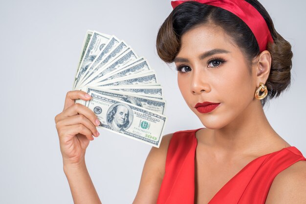 Happy Fashion beautiful woman hand holding dollar money