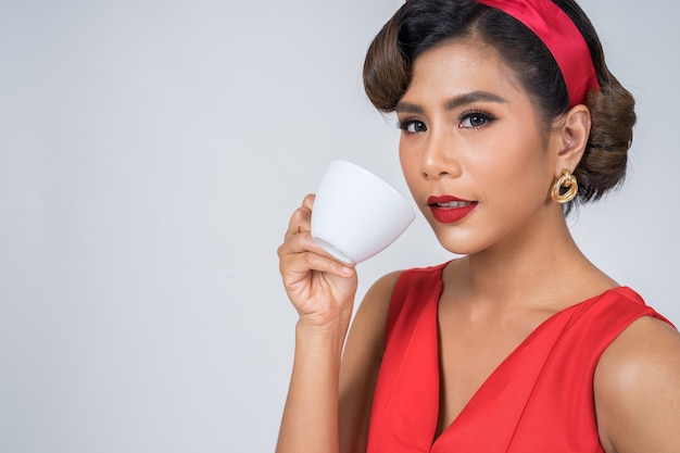 Happy fashion woman hand holding coffee cup