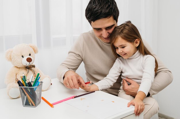 Happy father and daughter at home together