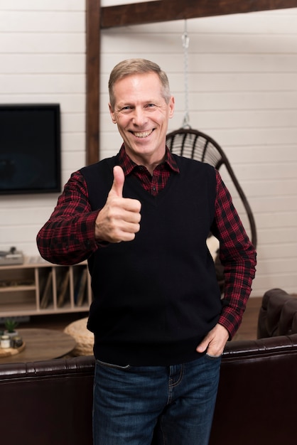 Happy father posing while giving thumbs up