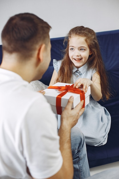 Happy father's day. Daughter greets dad. Little daughter with dad.