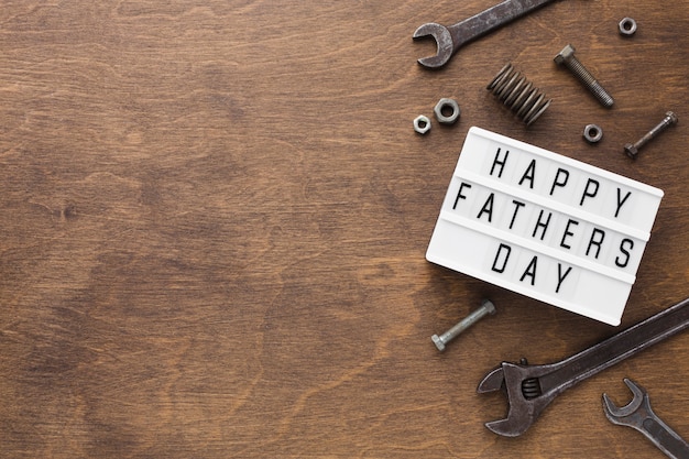 Happy father's day on wooden background