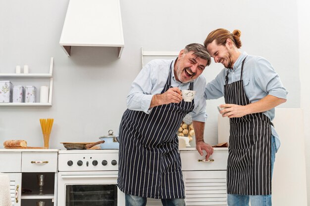 Happy father and son drinking coffee