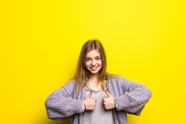Happy female college student showing thumbs up isolated
