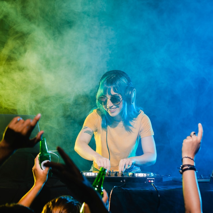 Free Photo happy female dj entertaining the big crowd