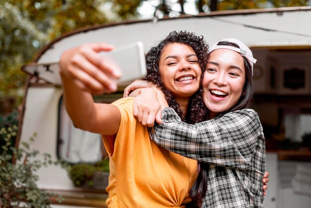 Happy female friends hugging each other