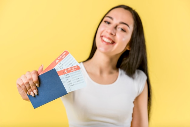 Free photo happy female holding travel documents